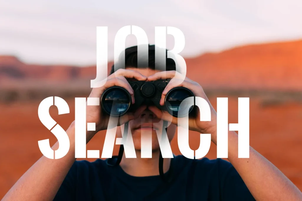Person using binoculars to search for job opportunities and employment openings